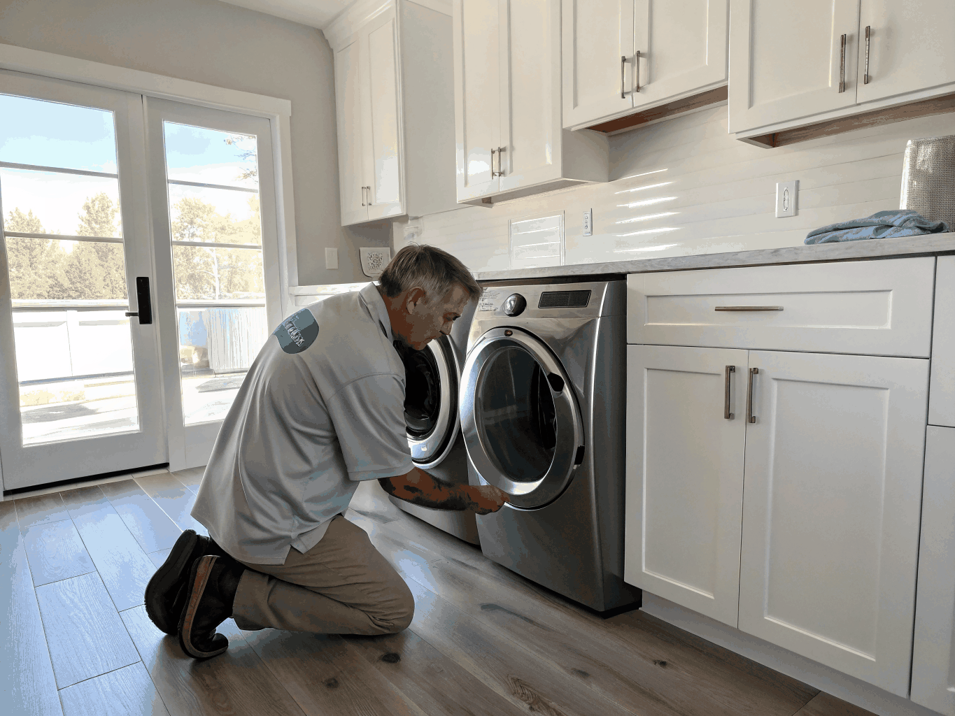 Technician servicing a Maytag washing machine and dryer in Mableton GA